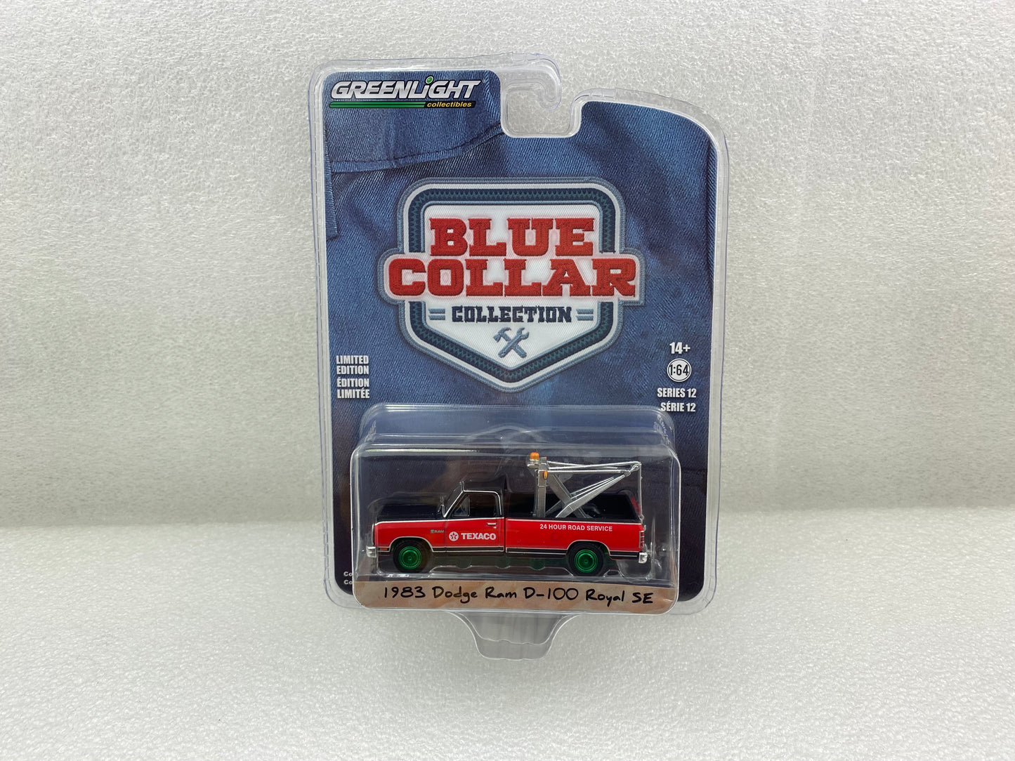 GreenLight Green Machine 1:64 Blue Collar Collection Series 12 - 1983 Dodge Ram D-100 Royal SE with Drop-In Tow Hook - Texaco 35260-C