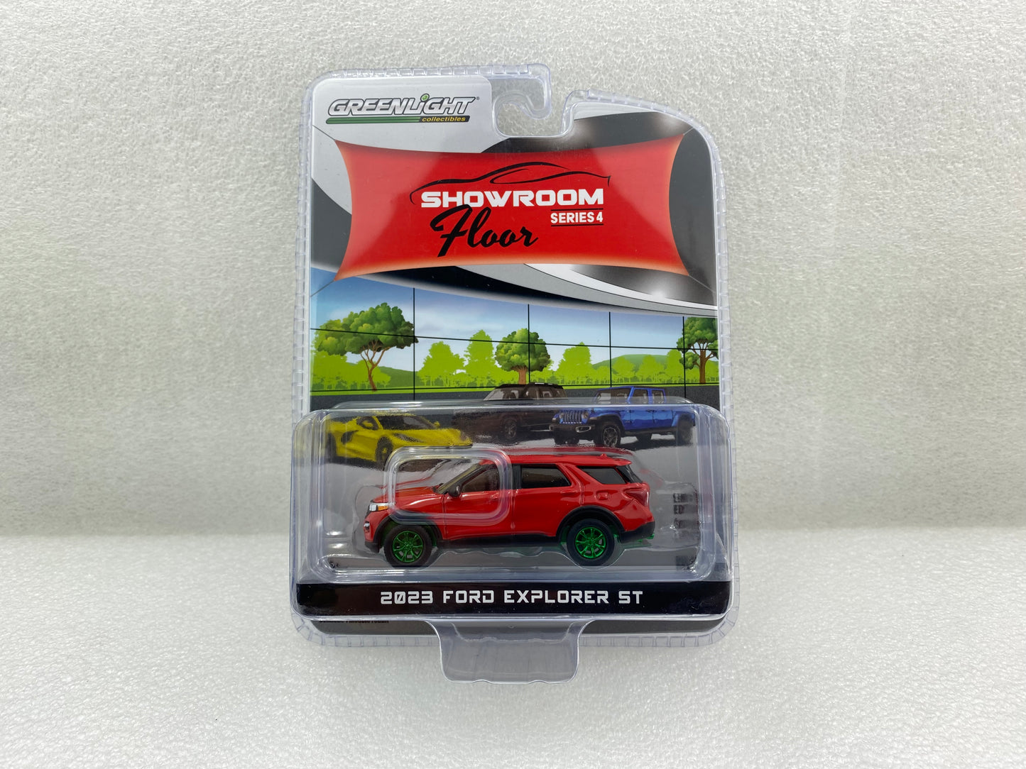 GreenLight Green Machine 1:64 Showroom Floor Series 4 - 2023 Ford Explorer ST - Rapid Red Metallic 68040-C