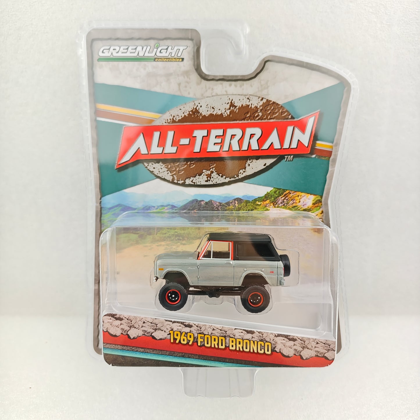 GreenLight Green Machine 1:64 All-Terrain Series 16 - 1969 Ford Bronco Lifted with Soft Top - Poppy Red 35290-B
