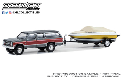 GreenLight 1:64 Hitch & Tow Series 29 - 1987 Chevrolet Suburban K20 Silverado with Boat and Boat Trailer 32290-B