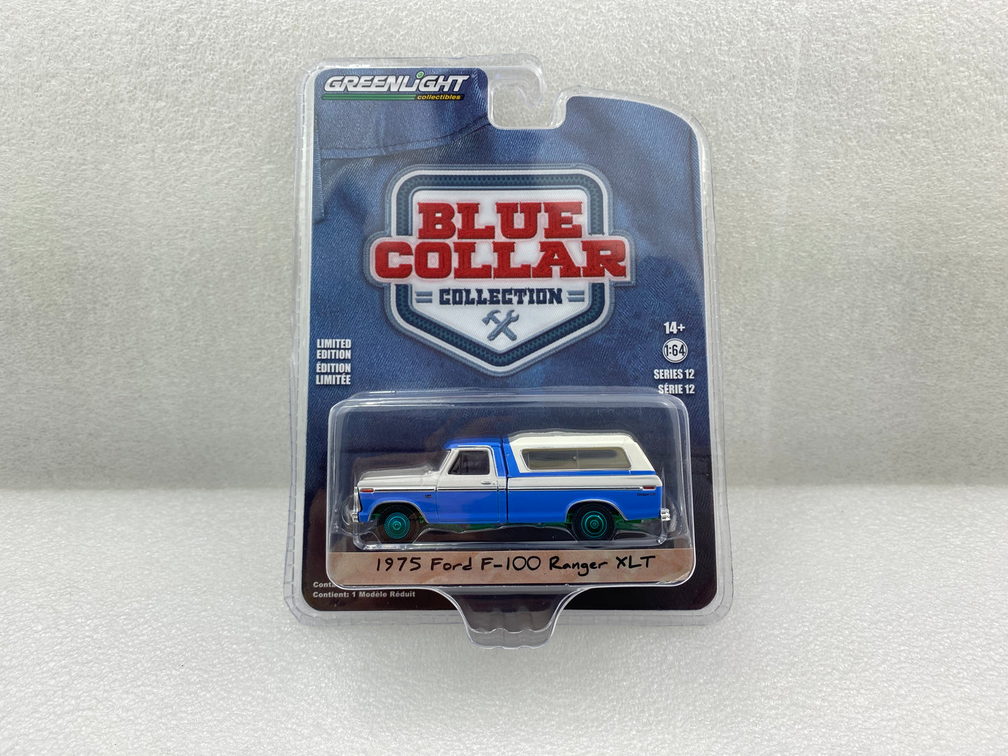 GreenLight Green Machine 1:64 Blue Collar Collection Series 12 - 1975 Ford F-100 Ranger XLT with Camper Shell - Wind Blue and Wimbledon White 35260-B