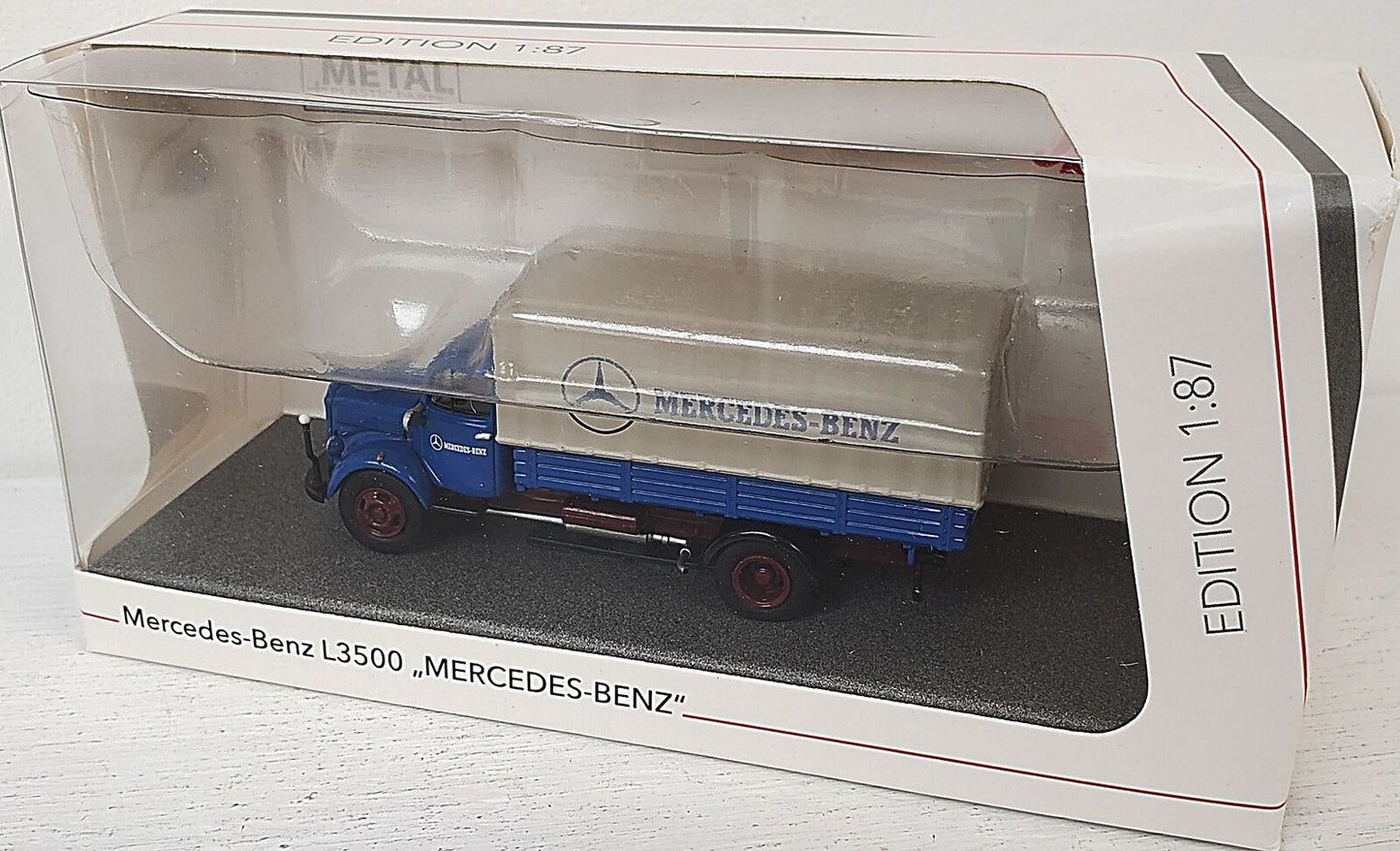 Schuco 1:87 Mercedes-Benz L3500 flatbed truck with tarpaulin 452667900