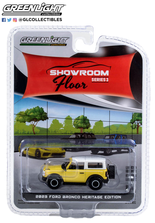 GreenLight 1:64 Showroom Floor Series 3 - 2023 Ford Bronco 2-Door Heritage Edition - Yellowstone Metallic with Oxford White Roof 68030-D