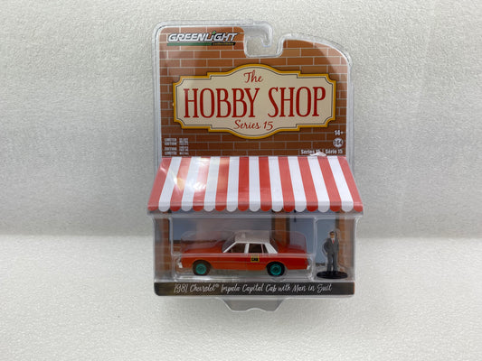 GreenLight Green Machine 1:64 The Hobby Shop Series 15 - 1981 Chevrolet Impala Capitol Cab Taxi with Man in Suit 97150-B