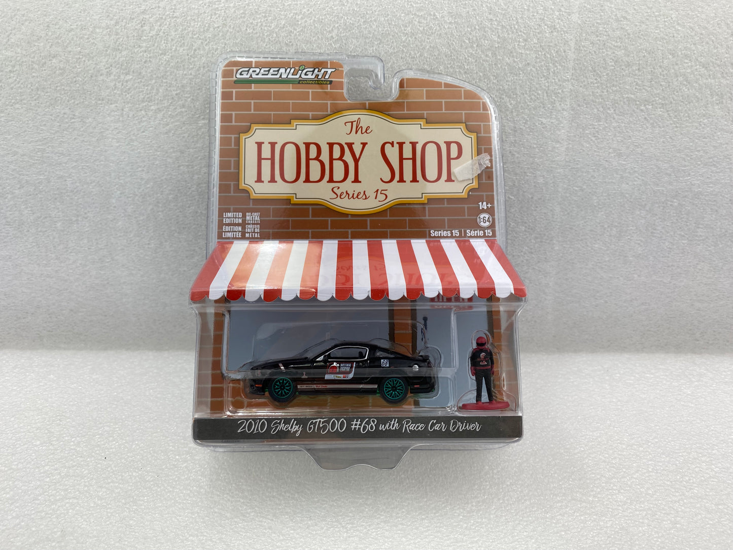 GreenLight Green Machine 1:64 The Hobby Shop Series 15 - 2010 Ford Shelby GT500 #68 - OPTIMA Ultimate Street Car Invitational with Race Car Driver 97150-E