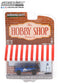 GreenLight 1:64 The Hobby Shop Series 12 - 2001 Jeep Cherokee Sport MOPAR Off-Road with Race Car Driver 97120-E