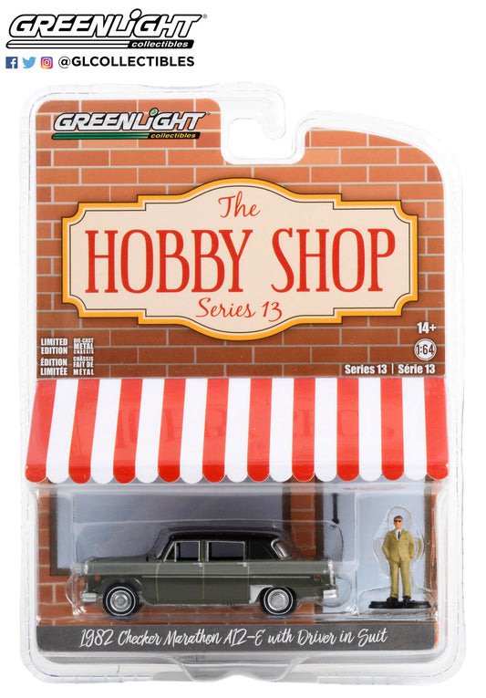 GreenLight 1:64 The Hobby Shop Series 13 - 1982 Checker Marathon A12-E with Driver in Suit 97130-C